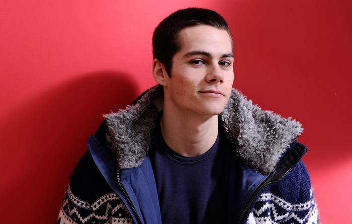 Dylan O'Brien wearing a patterned jacket
