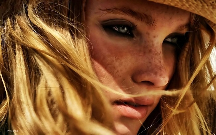 Elsa Hosk close-up portrait with straw hat