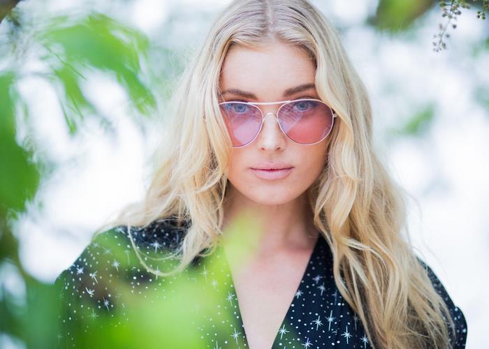 Elsa Hosk wearing sunglasses and a starry dress