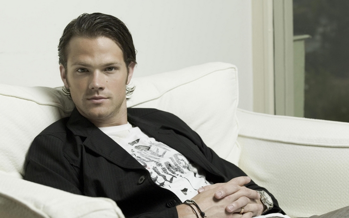 Jared Padalecki sitting on a couch