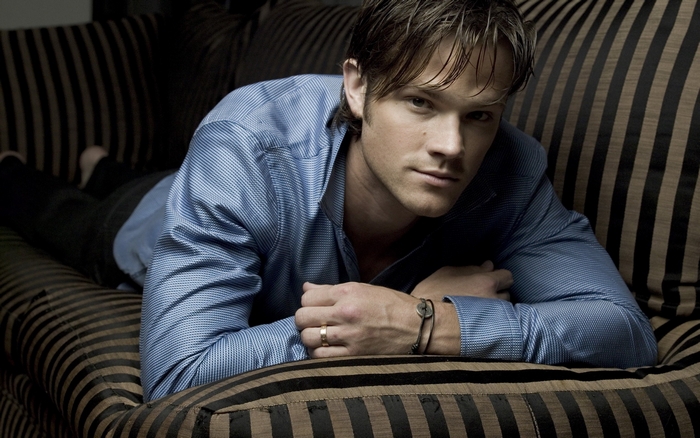 Jared Padalecki lying on a couch