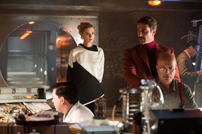 Elizabeth Debicki in a retro-futuristic laboratory