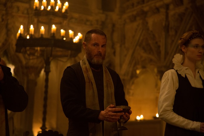 Man holding chalice in church