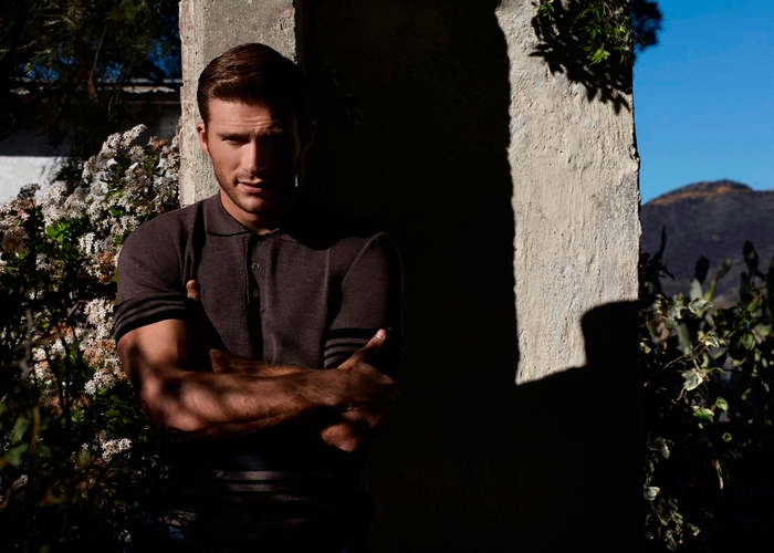 Scott Eastwood leaning against a wall
