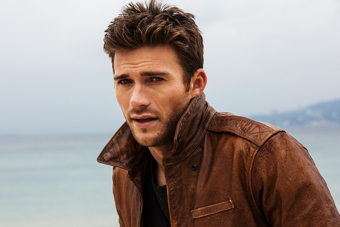 Scott Eastwood wearing a brown leather jacket