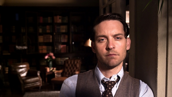 Tobey Maguire in a library