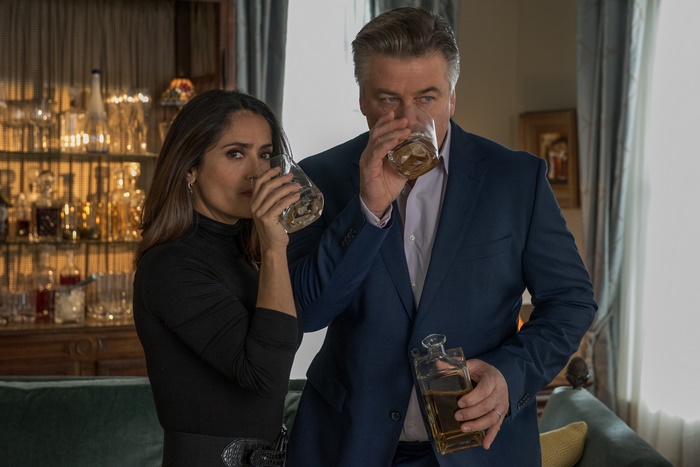 Alec Baldwin and Salma Hayek drinking whiskey