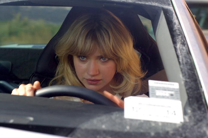Imogen Poots driving a car