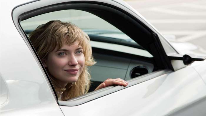 Imogen Poots in a white car