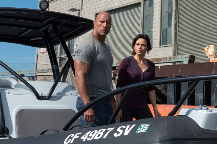 Dwayne Johnson and Carla Gugino on a boat