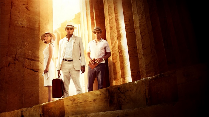 Three people in ancient Egyptian ruins