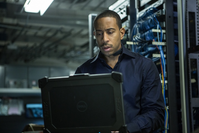 Ludacris in a server room with a laptop
