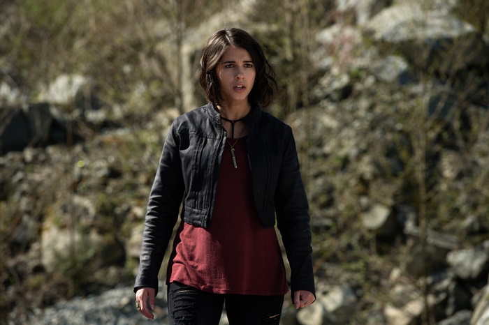 Naomi Scott in a black jacket