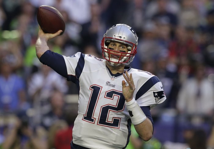 Tom Brady throwing a football