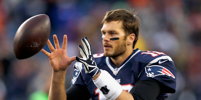 Tom Brady throwing a football