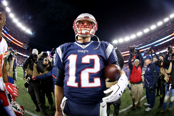 Tom Brady from New England Patriots holding football