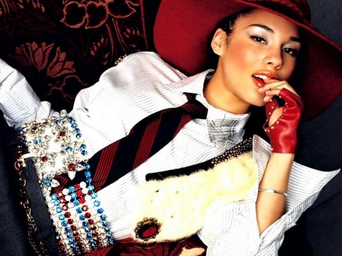 Alicia Keys wearing a red hat and gloves