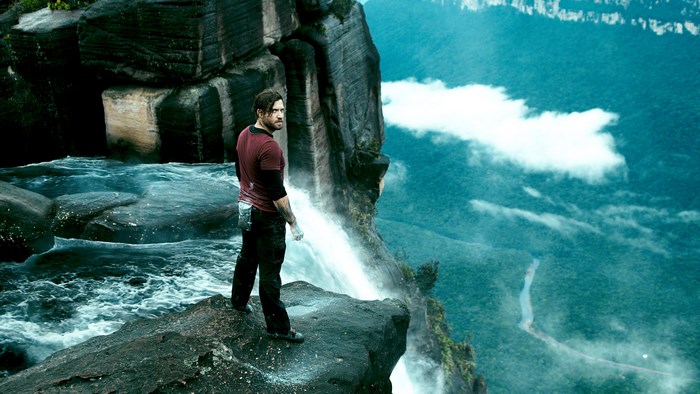 Edgar Ramírez on a cliff edge with waterfall