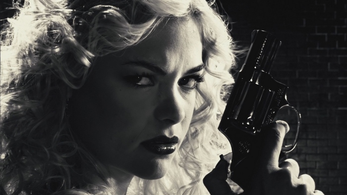 Jaime King holding a revolver