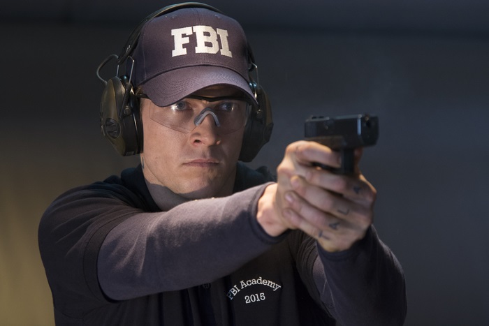 Luke Bracey as FBI agent at shooting range