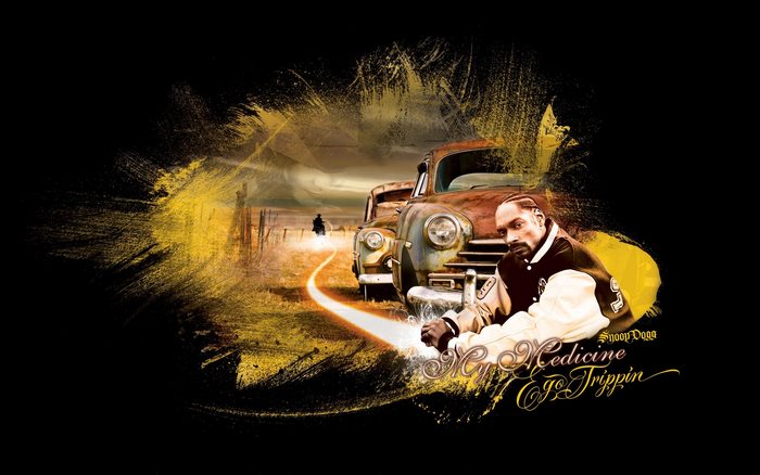 Snoop Dogg with vintage cars and desert landscape