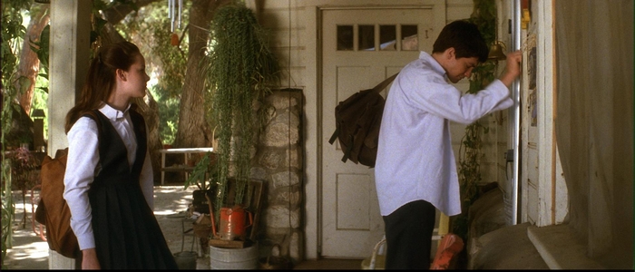 Jena Malone on a porch