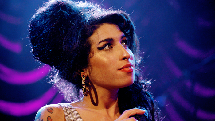 Amy Winehouse performing on stage