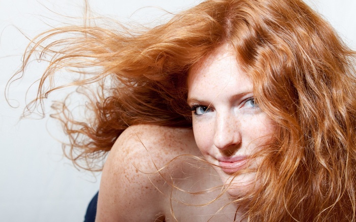 Woman with red hair and freckles