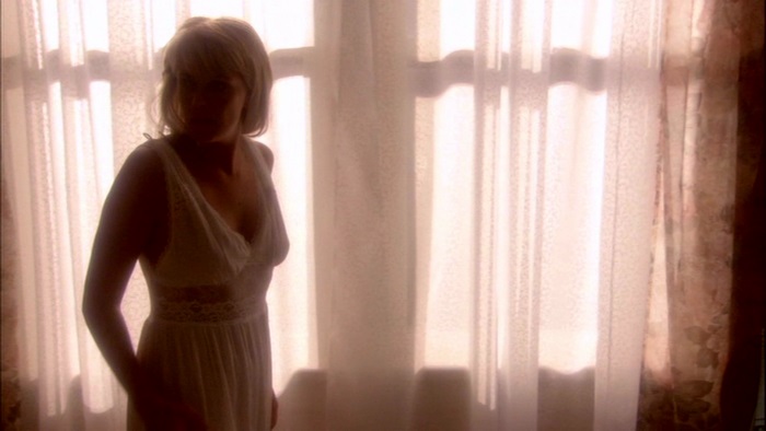 Amanda Tapping in a white dress