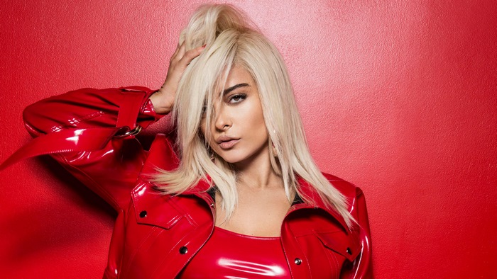 Bebe Rexha in Shiny Red Outfit with Blonde Hair