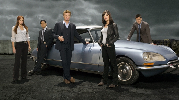 The Mentalist cast with a car