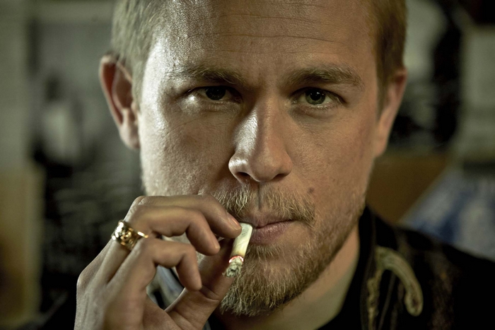 Charlie Hunnam smoking a cigarette