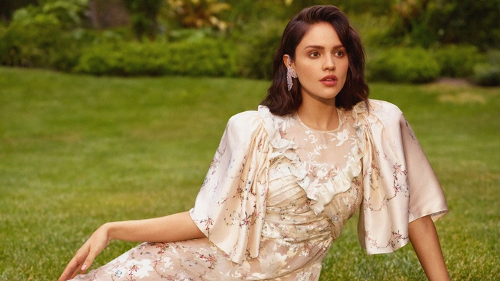 Eiza González in a floral dress outdoors