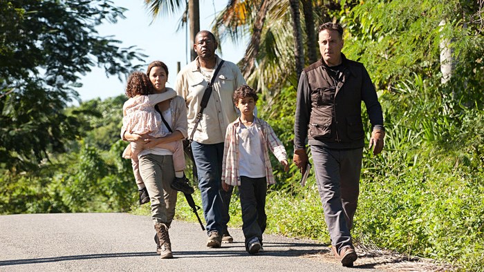 Forest Whitaker and others walking on a road