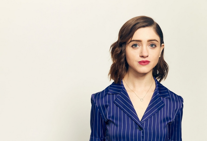 Natalia Dyer in a blue pinstripe suit