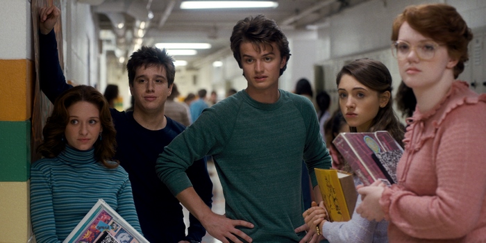 Nancy Wheeler and friends in a school hallway