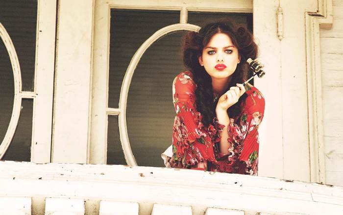 Odeya Rush holding binoculars