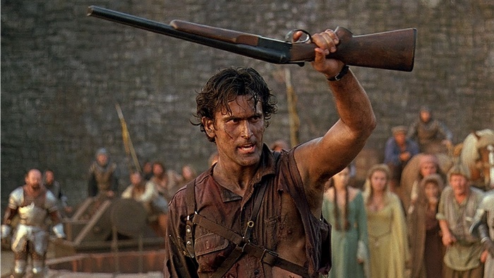 Bruce Campbell holding a shotgun in Army of Darkness