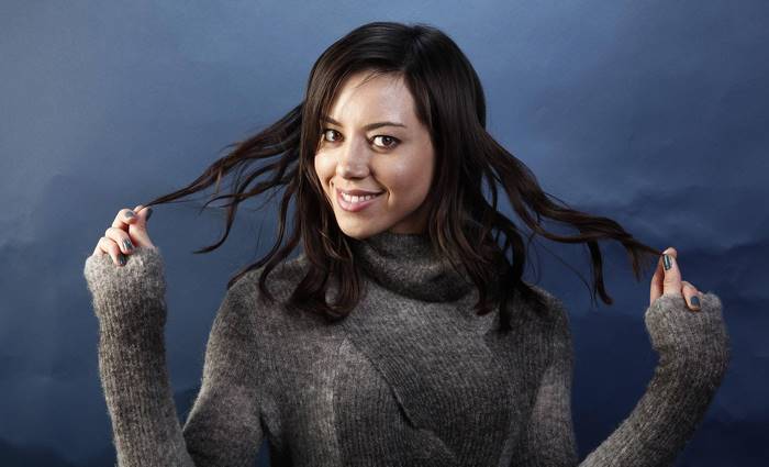 Aubrey Plaza in a grey sweater