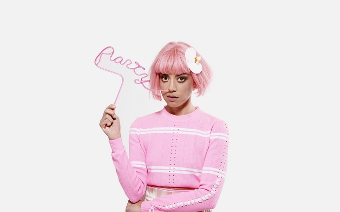 Aubrey Plaza with pink wig and party straw