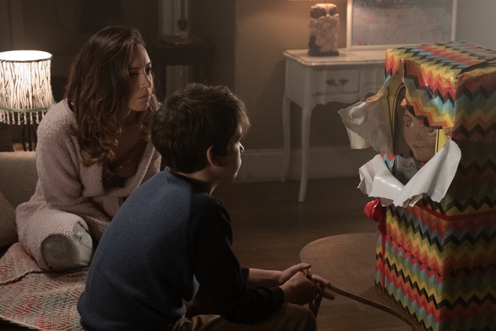 Aubrey Plaza and a boy with a doll