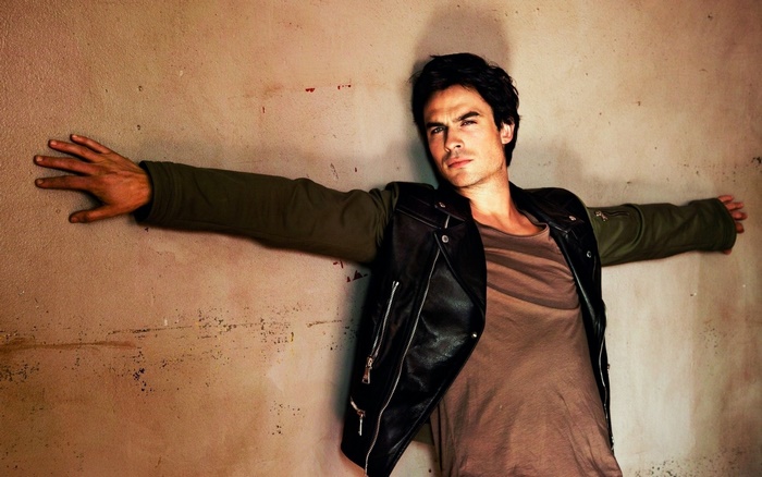 Ian Somerhalder leaning against a wall