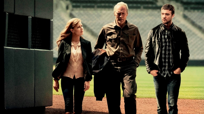 Clint Eastwood, Justin Timberlake, and Amy Adams on a baseball field