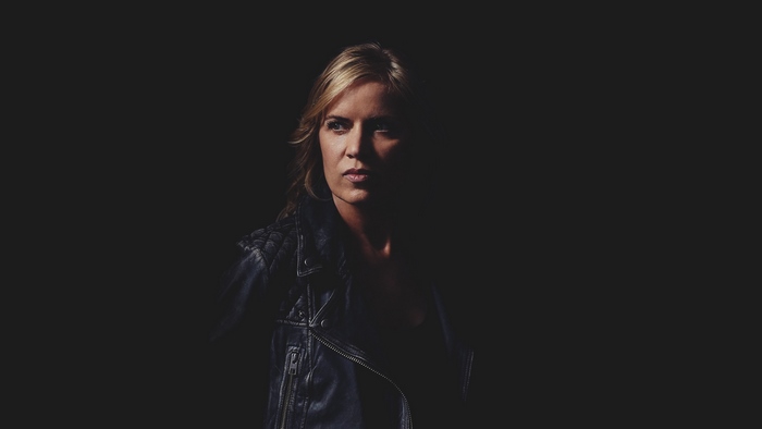 Kim Dickens in a leather jacket