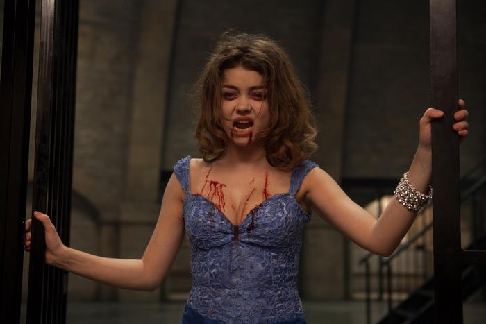 Sarah Hyland in a blue dress with blood