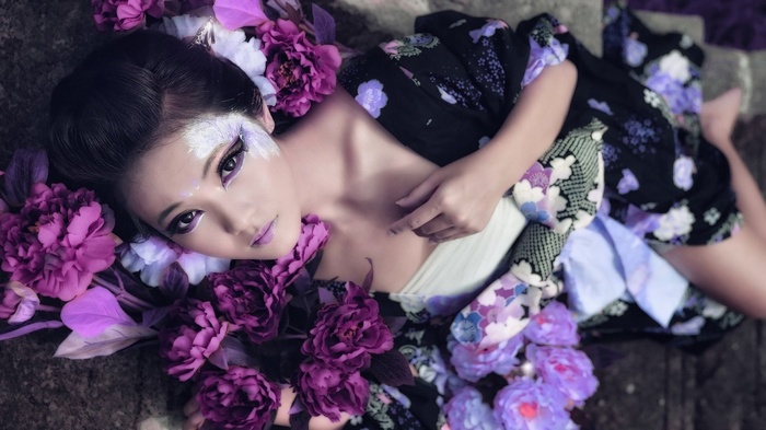 Woman in kimono with purple flowers