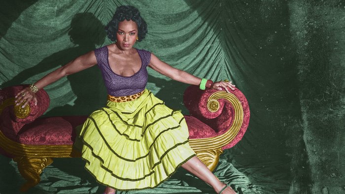 Angela Bassett on a chaise lounge