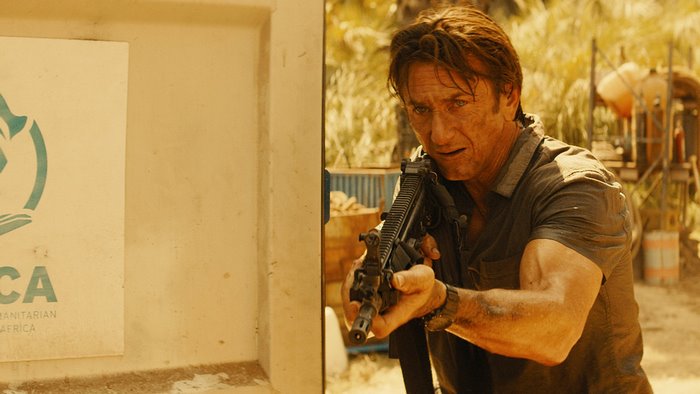 Sean Penn with a rifle