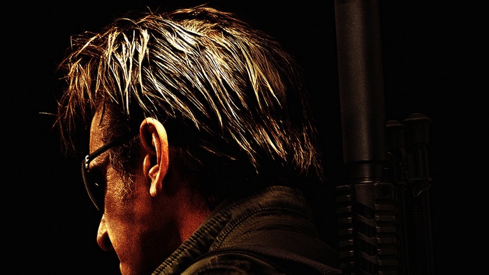 Sean Penn with a rifle