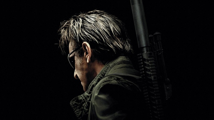 Sean Penn with a rifle